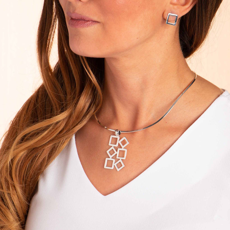 Dije y aretes cuadros de Plata