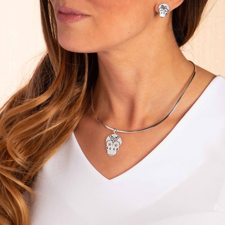 Dije y aretes Calaveras de Plata