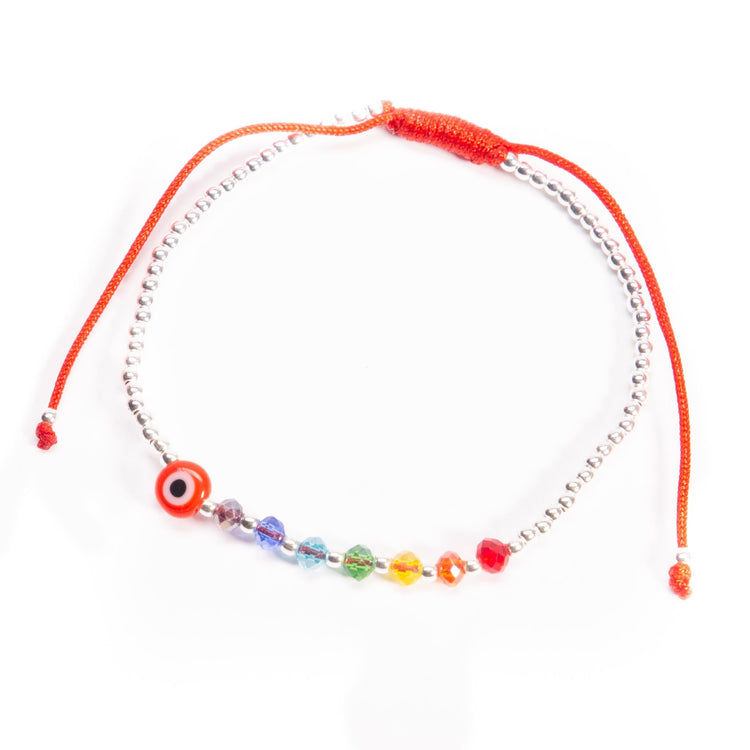 Pulsera de hilo con ojo turco, cristalitos y bolitas de plata