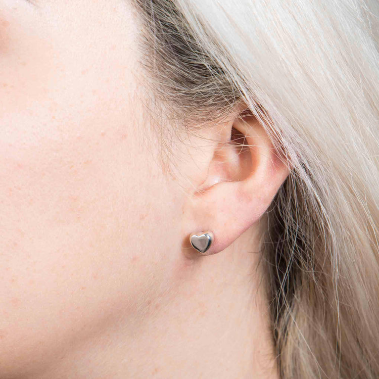 Aretes de plata forma corazón