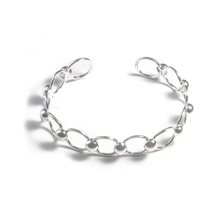 Brazalete aros y medias esferas intercaladas de plata