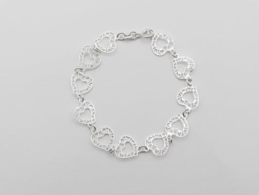 Pulsera corazones calados de plata