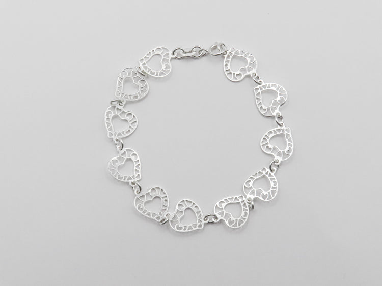 Pulsera corazones calados de plata