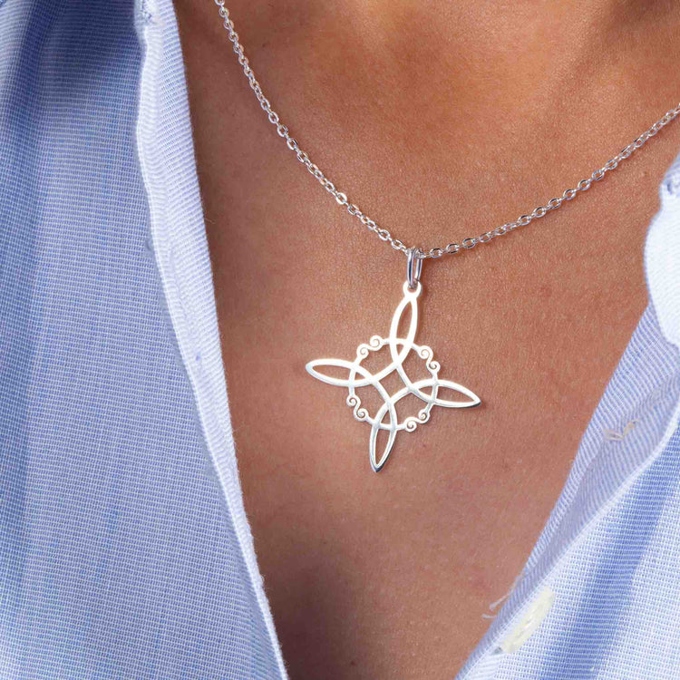 Dije nudo de bruja de plata